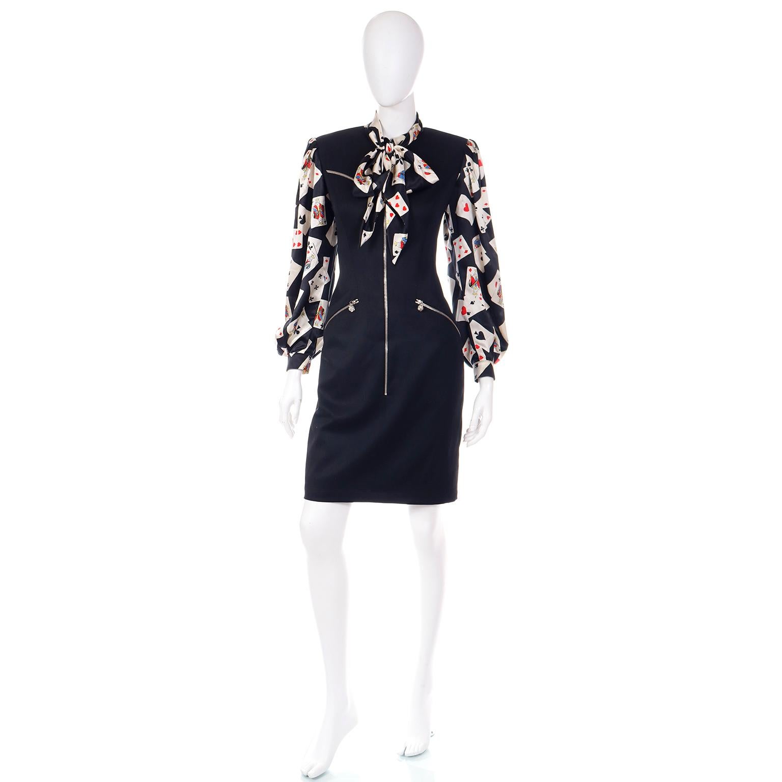 This is an incredible vintage Emanuel Ungaro black wool dress with a built in connected silk blouse in a novelty playing card print. We love Ungaro prints and this is such a fun play on a traditional blouse and dress! The blouse  has a self tie sash