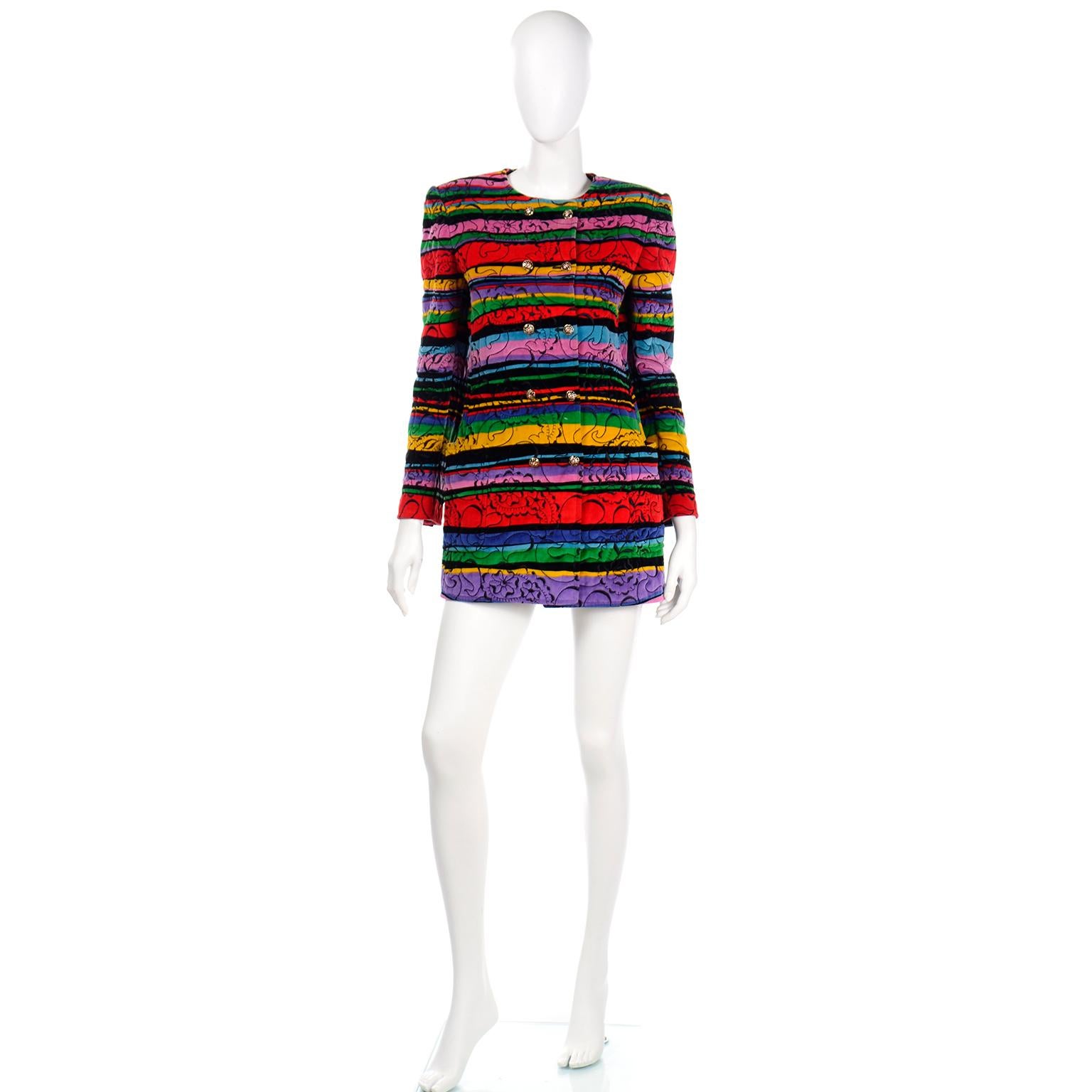 This phenomenal vintage Emanuel Ungaro Parallele jacket is bursting with color! The lush cotton faced velvet fabric is topstitched with black abstract shapes and the body of the jacket consists of various widths of horizontal stripes in a virtual