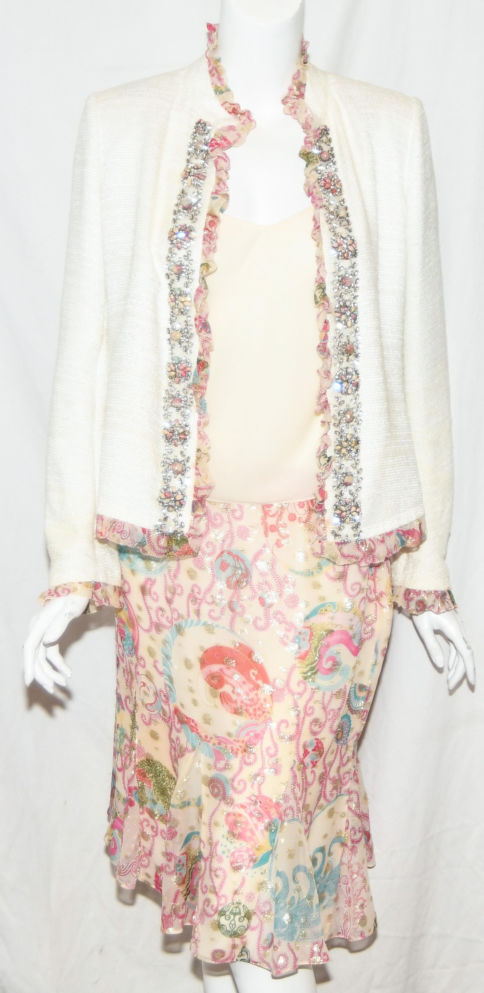 Emanuel Ungaro Ivory Jacket decorated with metallic floral ruffles around the neckline cascading down the front on both sides of opening, around the hem and cuffs.  This jacket also contains a crystal placket on each side emphasizing the delicate