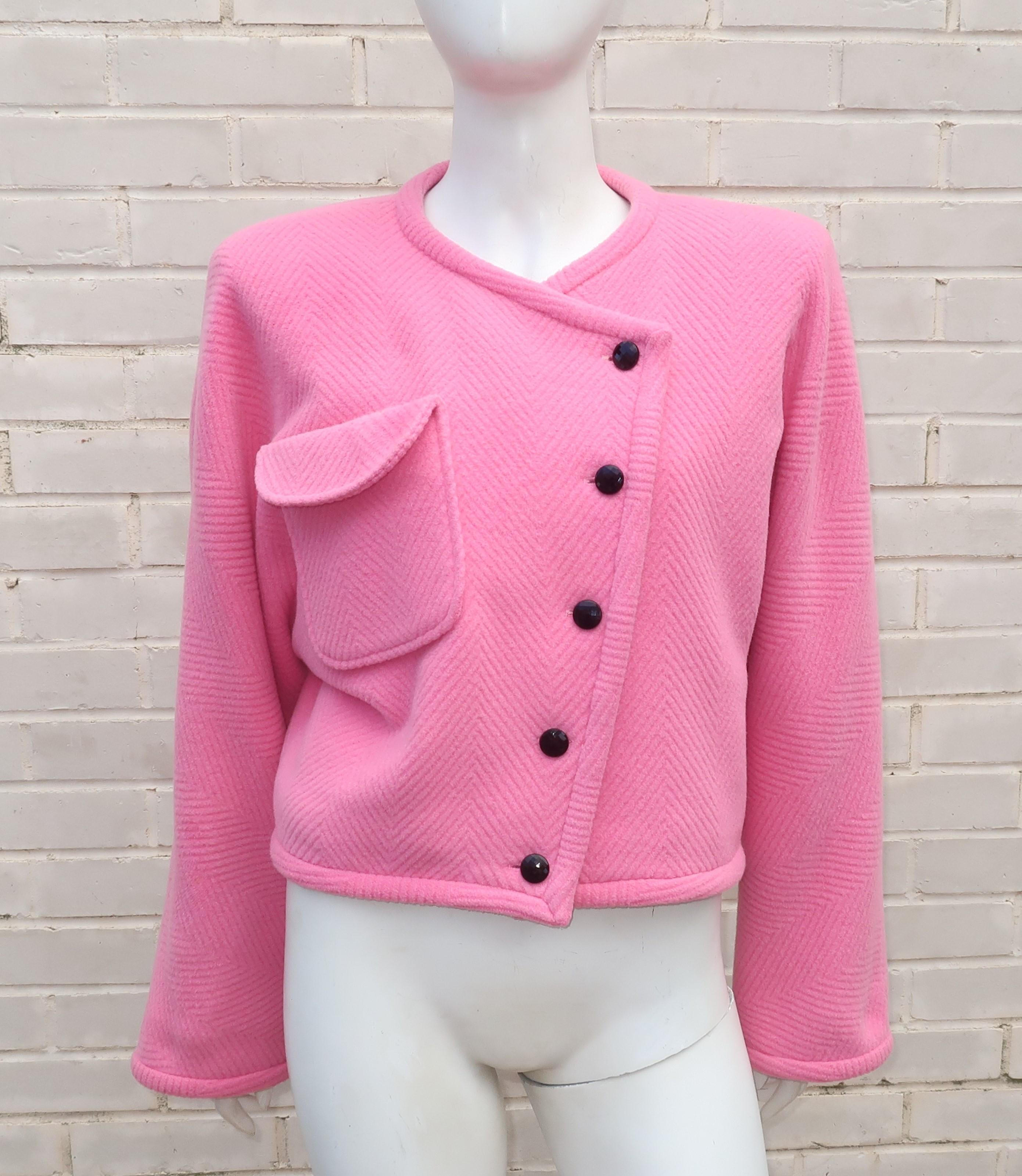 1980's Emanuel Ungaro cropped jacket in a cozy pink wool with a herringbone pattern.  The collarless jacket has an asymmetrical black button front with one large breast pocket.  It offers a boxy silhouette with full sleeves and a classic 1980's