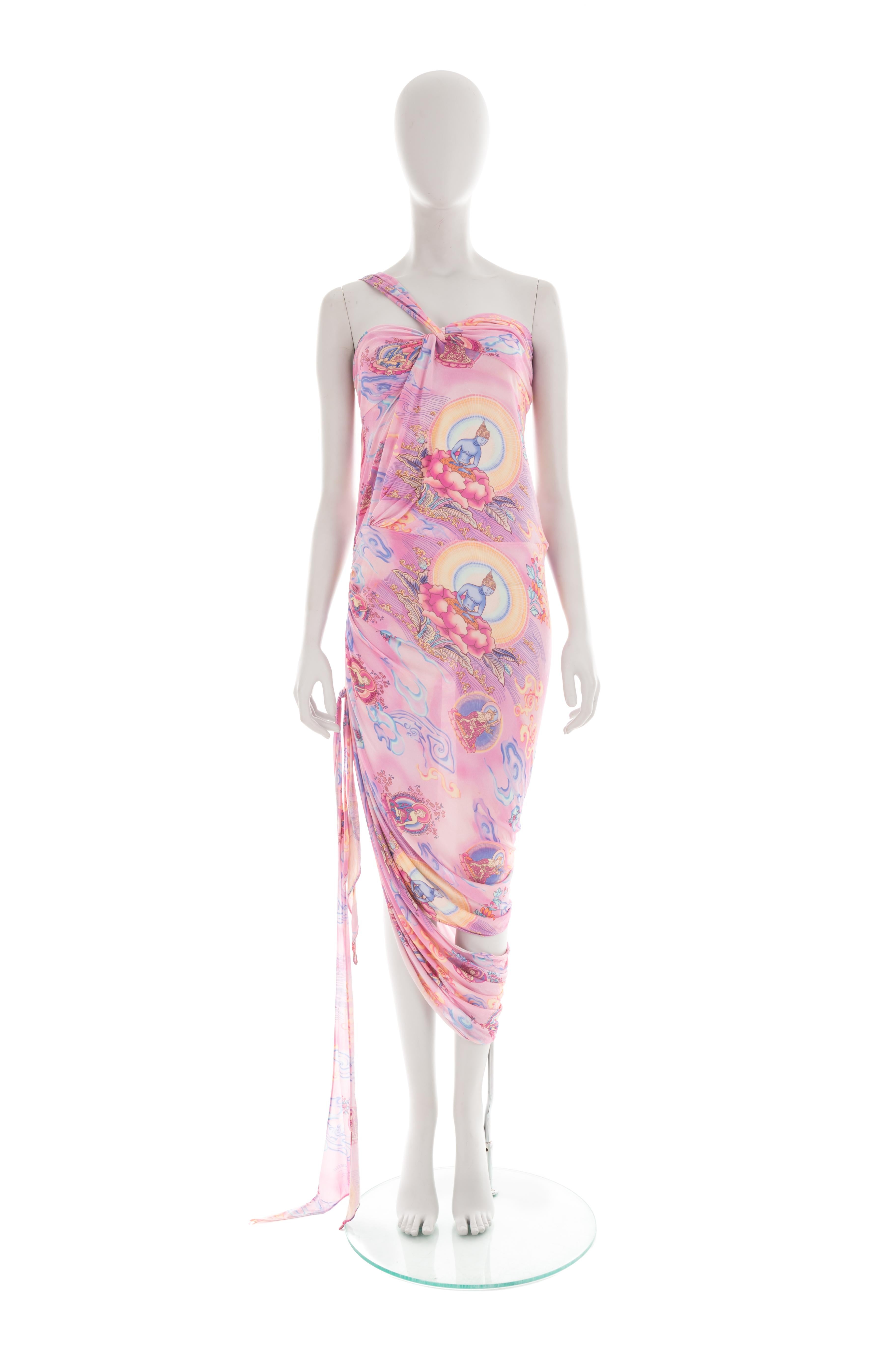 - Emanuel Ungaro by Giambattista Valli 
- Spring-summer 2004 collection
- Sold by Gold Palms Vintage
- Pink viscose draped dress
- “Shiva” print with blue, purple and yellow hues 
- One shoulder
- Side leg cut-out
- Knot detailing
- Side zipper
-