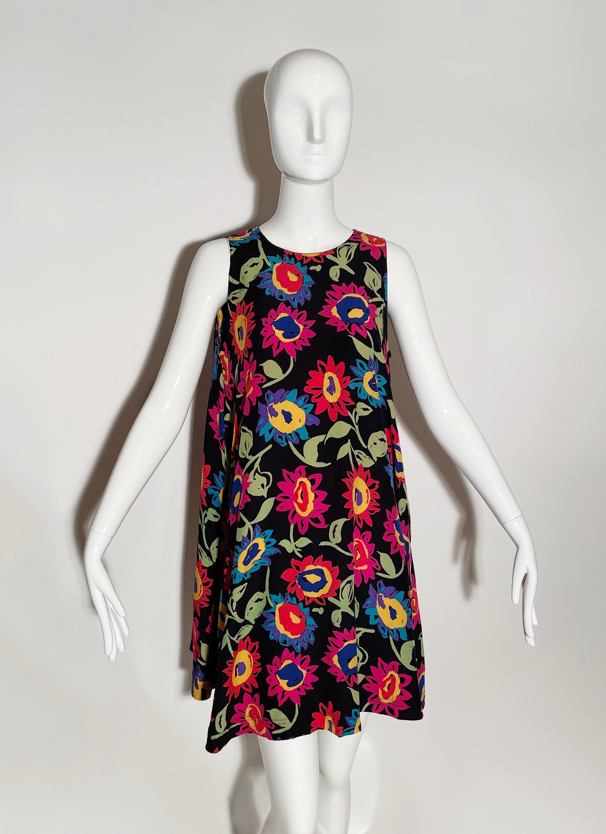 Black floral summer dress. Lightweight and relaxed. Sleeveless. Closure at back. Pockets at side. Silk. Made in Hong Kong.

*Condition: good vintage condition, there are a few small areas where color has bled on flowers (as pictured), not