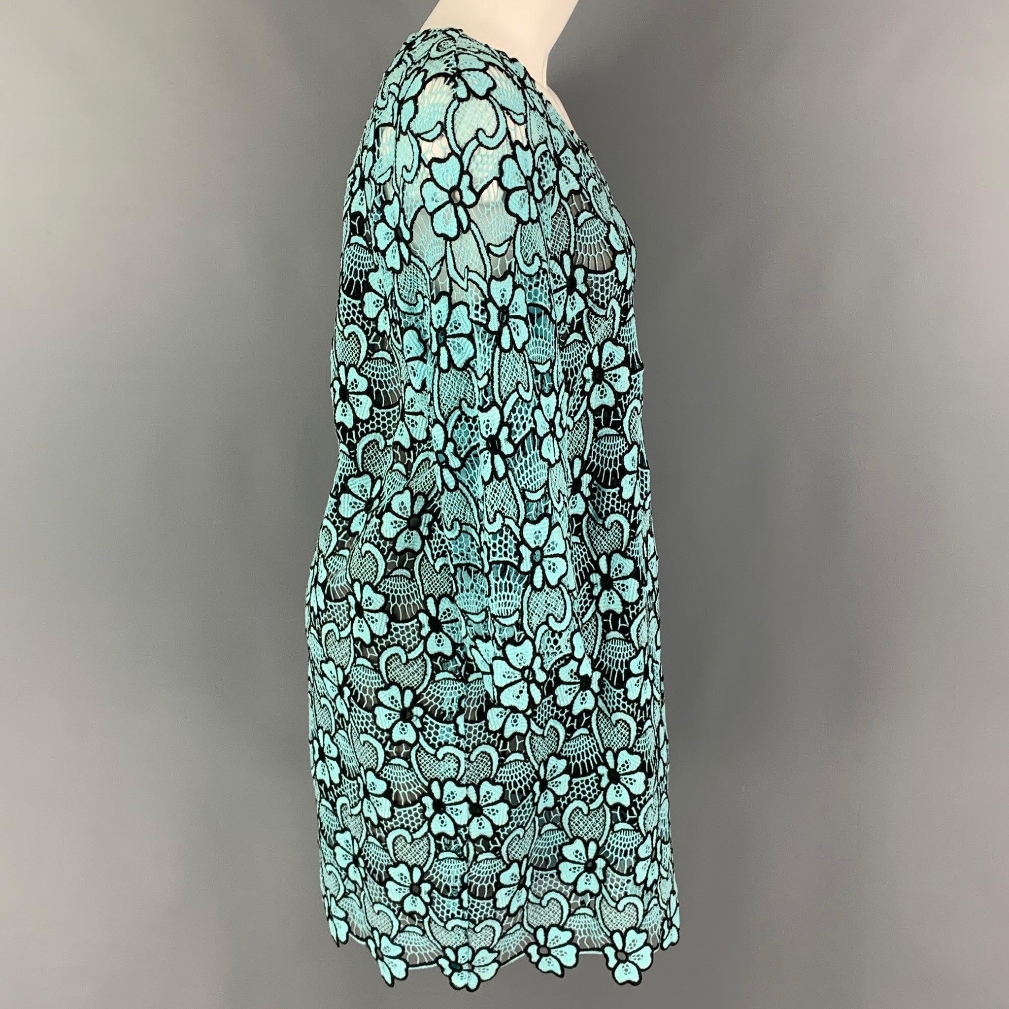 EMANUEL UNGARO dress comes in a blue & black eyelet floral cotton / polyester featuring a shift style, 3/4 sleeves, and a back zipper closure.
Excellent
Pre-Owned Condition. 

Marked:   I 44 / D 40 / F 40 / GB 12 / USA 10 

Measurements: 
