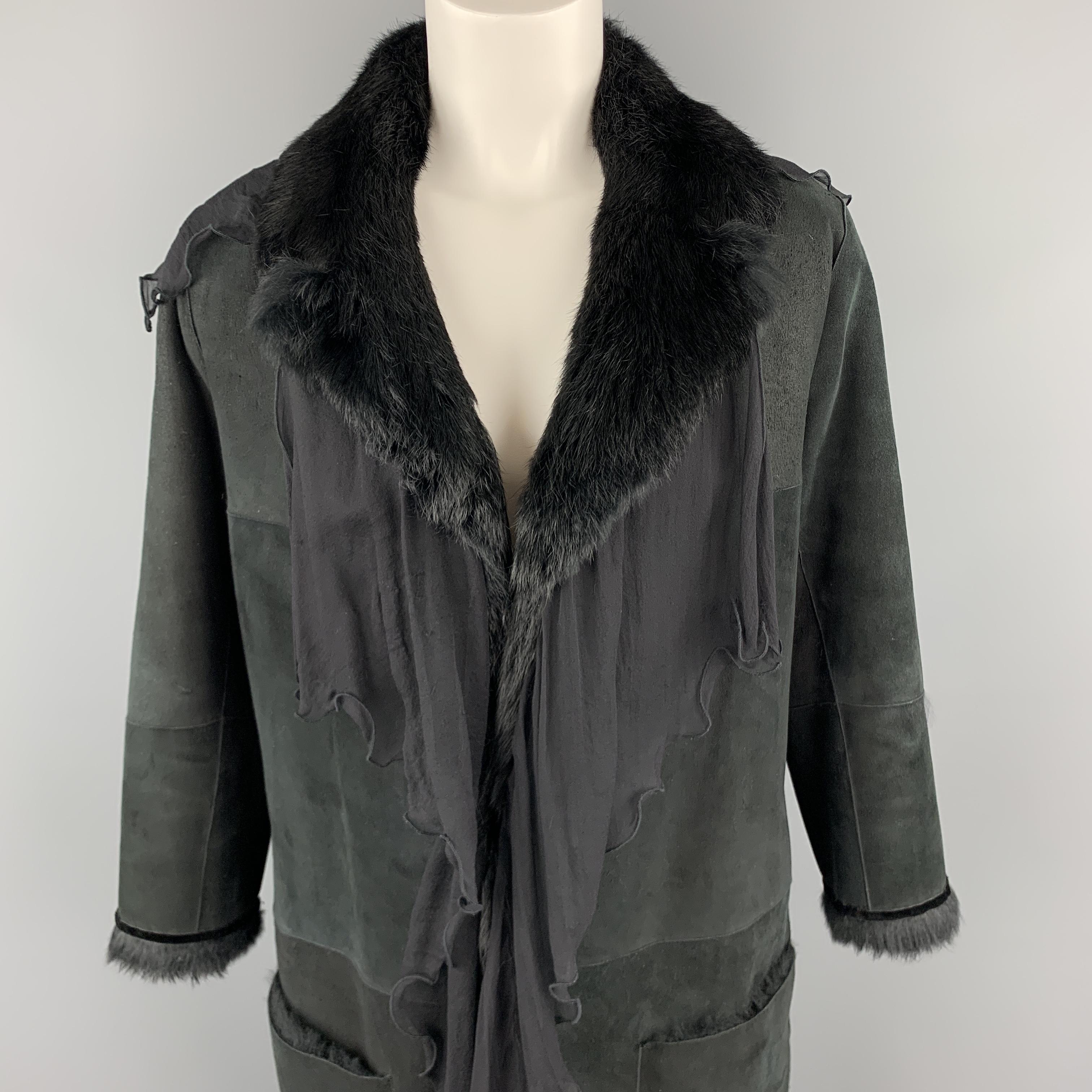 Vintage EMANUEL UNGARO coat comes in black sueded shearling with full rabbit fur interior, open front with notch lapel, patch pockets, and chiffon ruffled trim. Wear throughout. As-is. Made in Italy.

Good Pre-Owned Condition.
Marked: EU