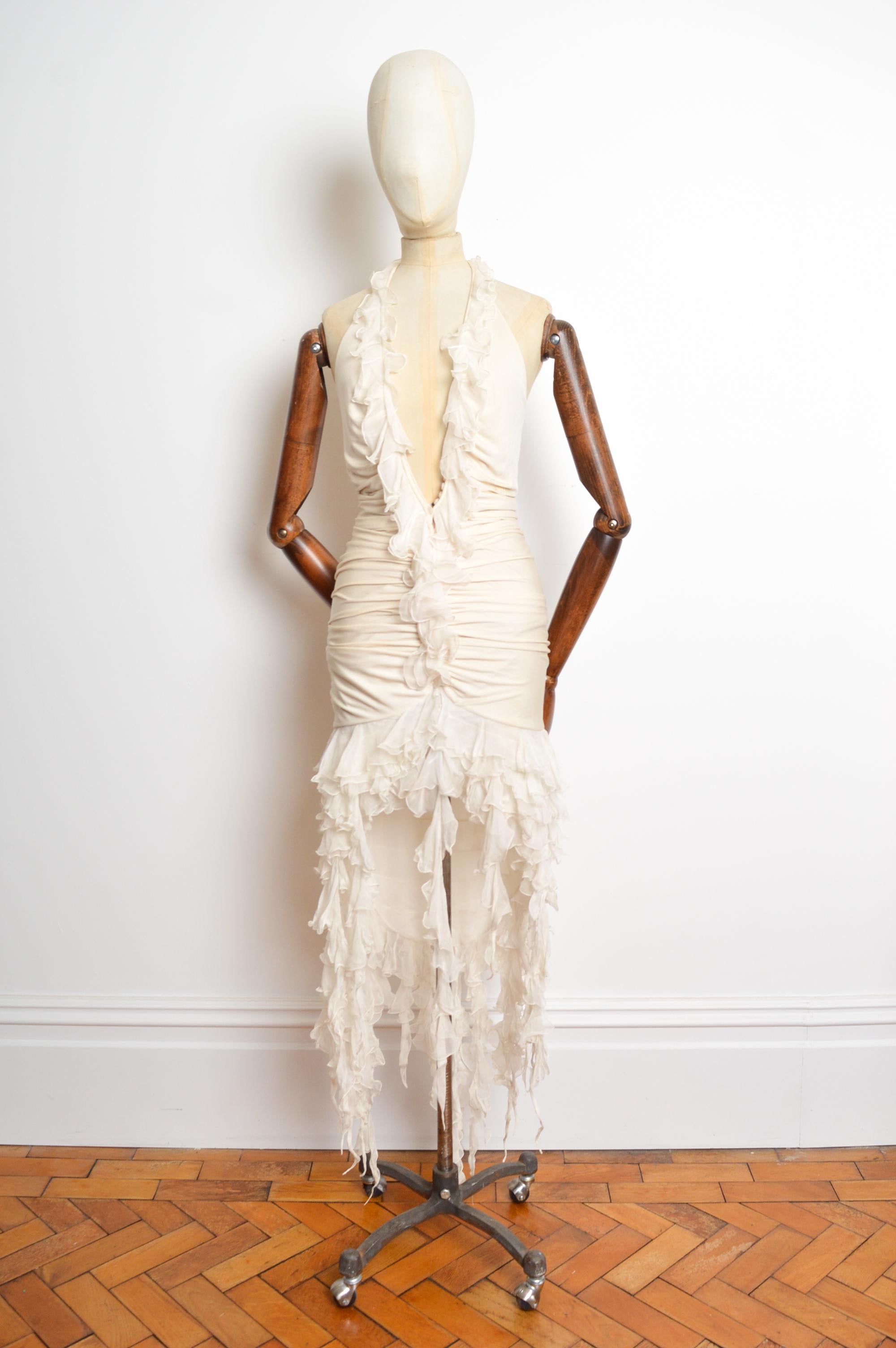 Emanuel Ungaro Spring / Summer 2003 Cream coloured, Silk tasseled halter neck cocktail dress with low cut décolleté and backless reverse.
As worn, iconically by Beyoncé Knowles for the Cover Artwork of her Album ‘Dangerously in love’ 2003. 
Size;