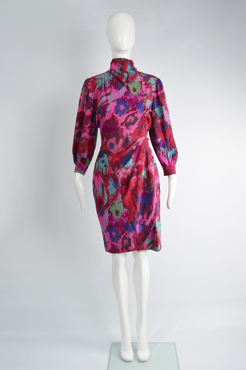 A beautiful vintage Emanuel Ungaro dress from the 80s in an abstract printed silk fabric with a high neck, draped details at the side and slightly cropped balloon sleeves. Perfect for a party or evening event. 

Size: Marked vintage UK 8 but this