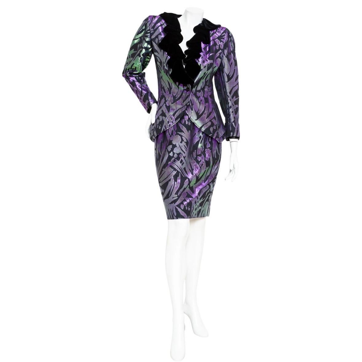 Emanuel Ungaro Vintage Iridescent Jacket and Skirt Suit

Vintage; 1988
Designed for Saks Fifth Avenue
Iridescent shot fabric
Jacket features a cascading ruffled velvet collar, puff sleeves, front button closure, back bow, and fitted silhouette