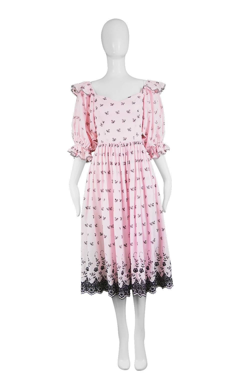 Click 'CONTINUE READING' below to see size & description. 

A romantic vintage women's off the shoulder dress from the 80s by David & Elizabeth Emanuel for their boutique label. The Emanuels were best known for their luxurious and feminine gowns,