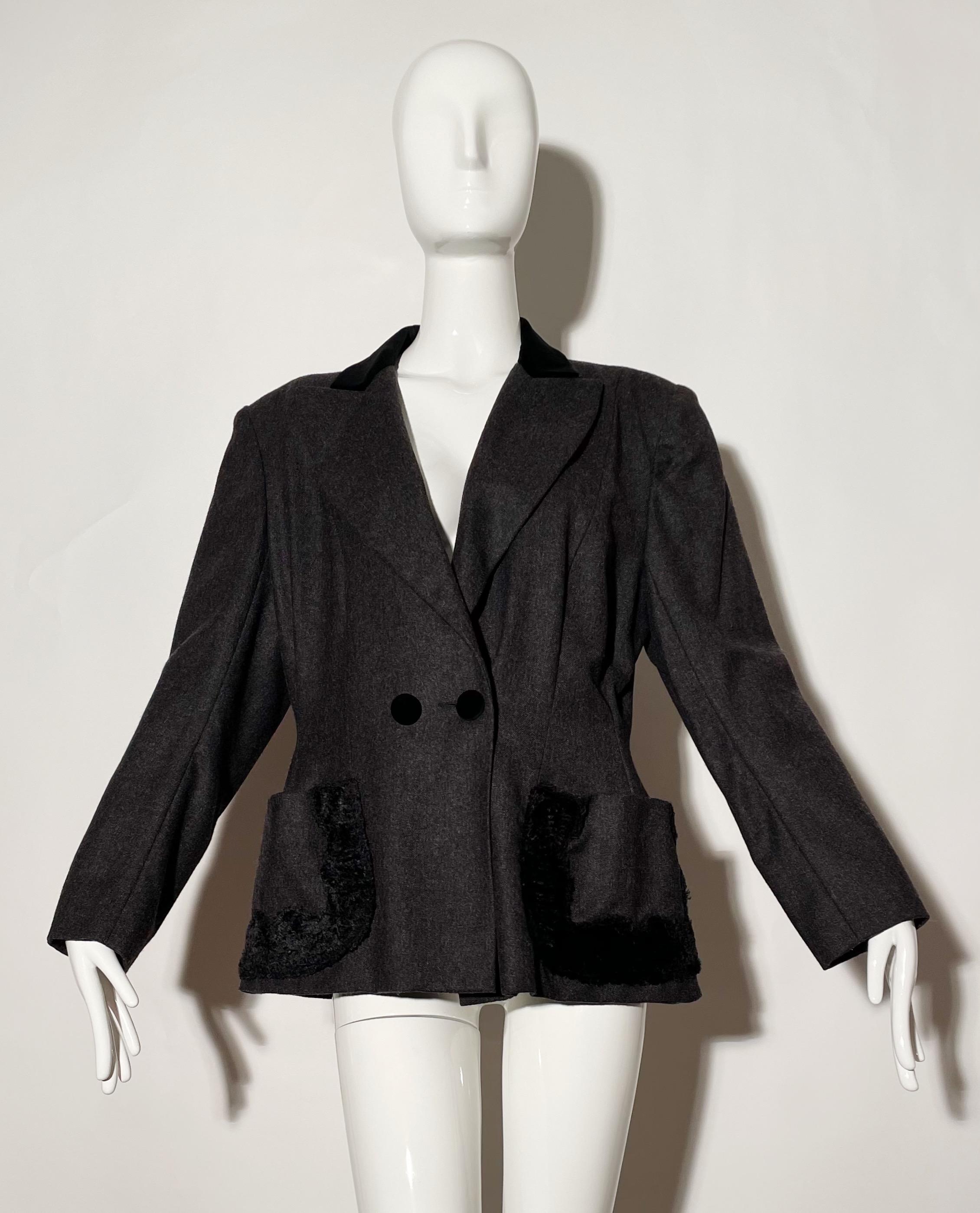 Charcoal grey blazer. Black velvet detail. Front buttons. Front pockets. Shoulder pads. Lined. Wool. Made in Paris. 
*Condition: Excellent vintage condition. No visible Flaws.

Measurements Taken Laying Flat (inches)—
Shoulder to Shoulder: 17