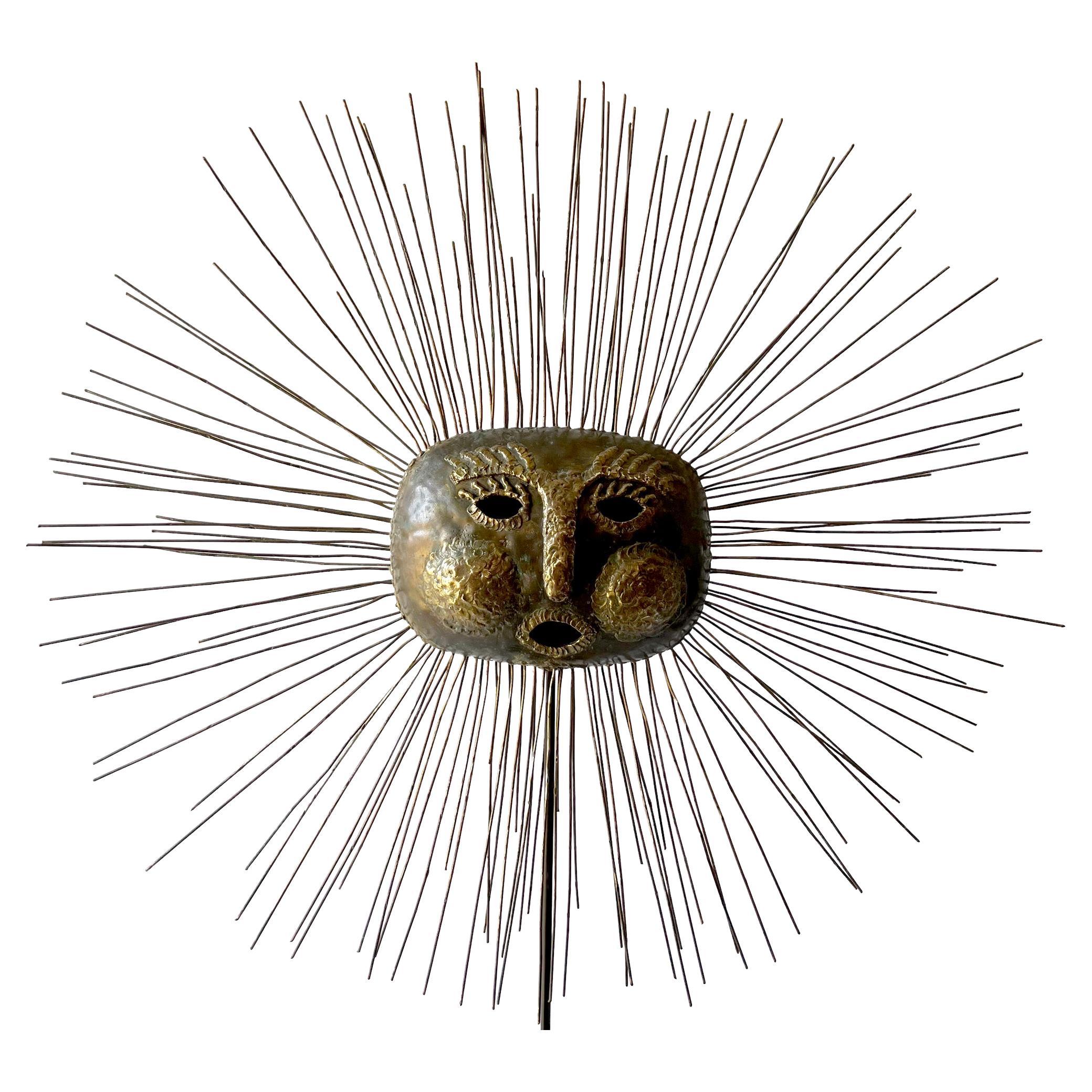 Massive scale brass and bronze sun face sculpture on wood stand, handcrafted by the Benedictine monk Emaus, their workshop is in Cuernavaca in the State of Morelos, Mexico.   

Sculpture measures 37