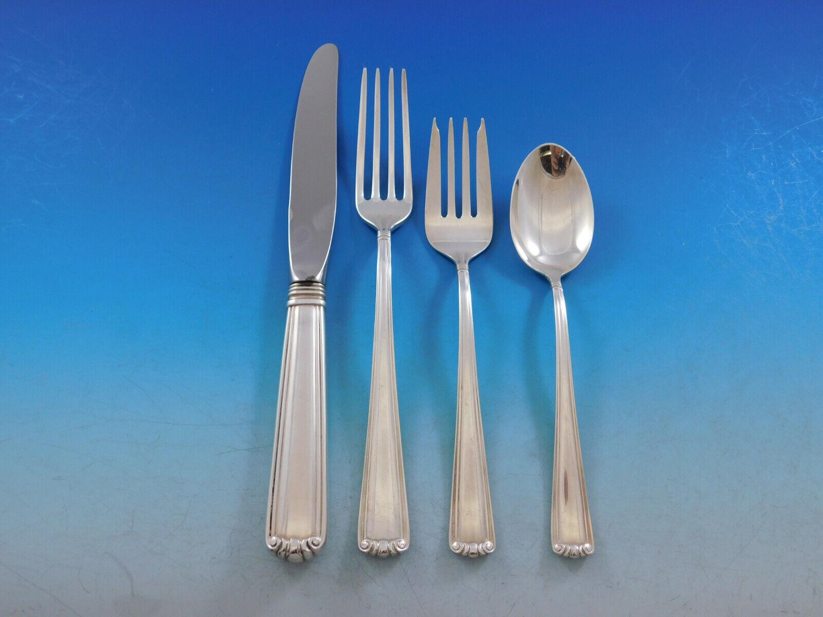 Superb Embassy Scroll by Lunt sterling silver Flatware set, 63 pieces. This set includes:

12 Knives, 8 3/4