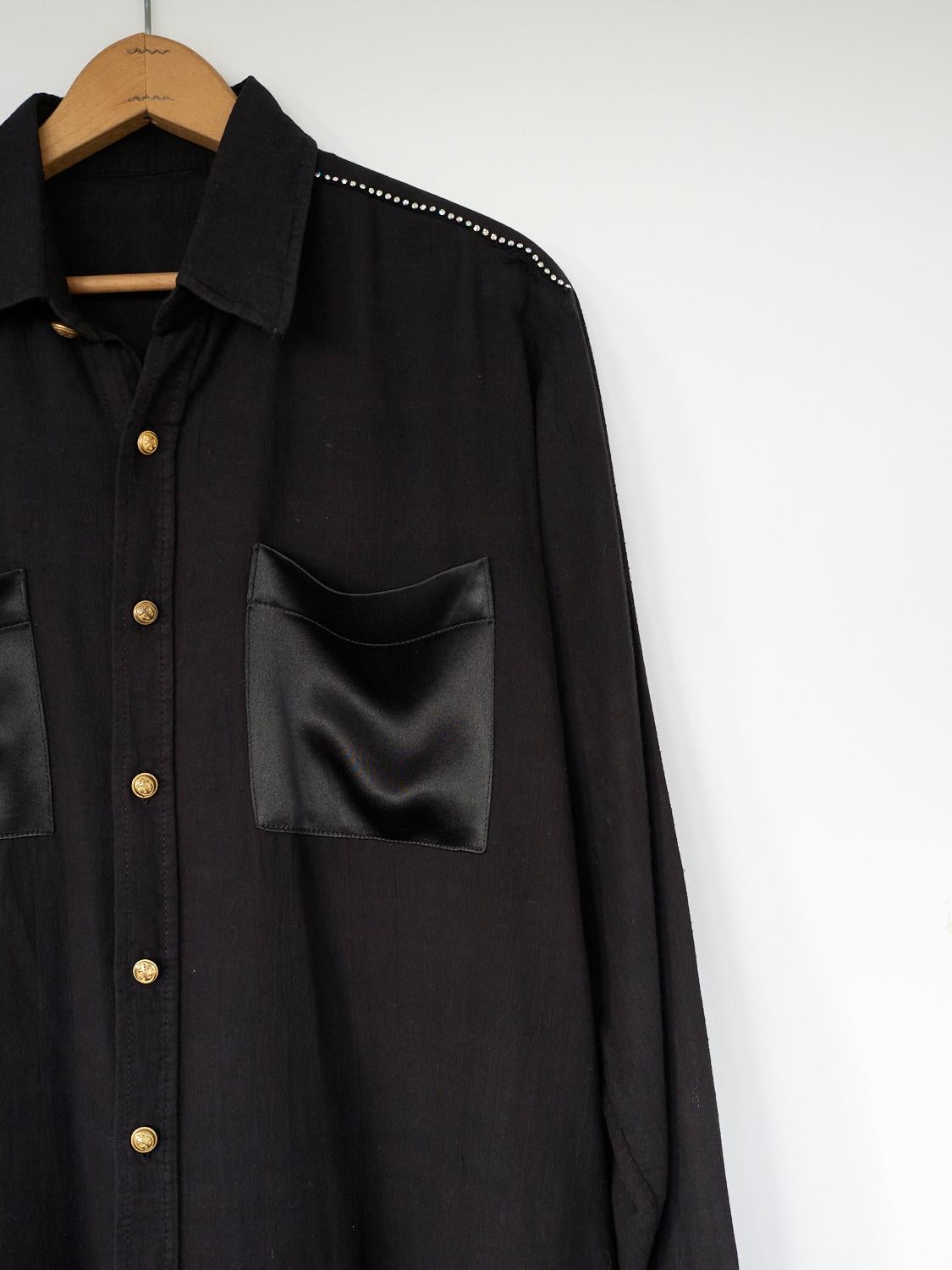 black shirt with gold buttons