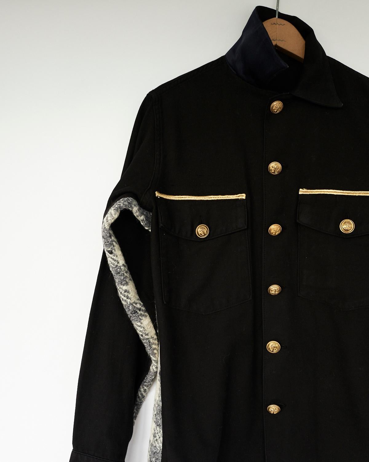 Embellished Black Us Military Fatigue Shirt Jacket Repurposed with Original Vintage Brass Buttons In Gold Color and Military Vintage Gold Braid, Side Panels of Vintage Italian Checker Wool in White Grey and Gold Braids above Pockets
Brand: J