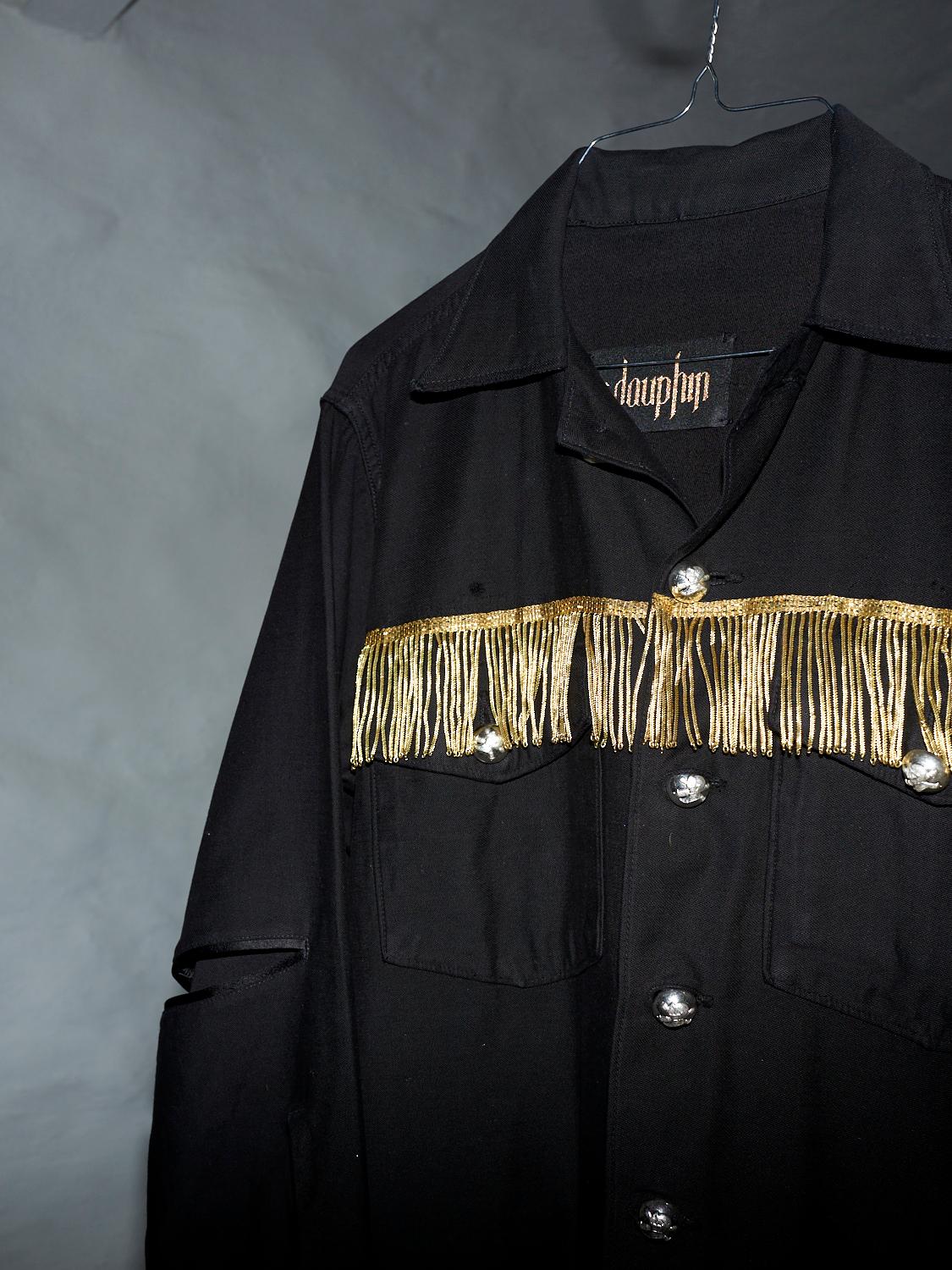 Embellished Repurposed Us Military Jacket from the 70's in 100% Cotton dyed Black, French Bullion Gold Fringe and Vintage Silver Tone Button in Brass with details of Black Duchesse 100% Silk 

Brand: J Dauphin
Size: S/M
Sustainable Luxury,