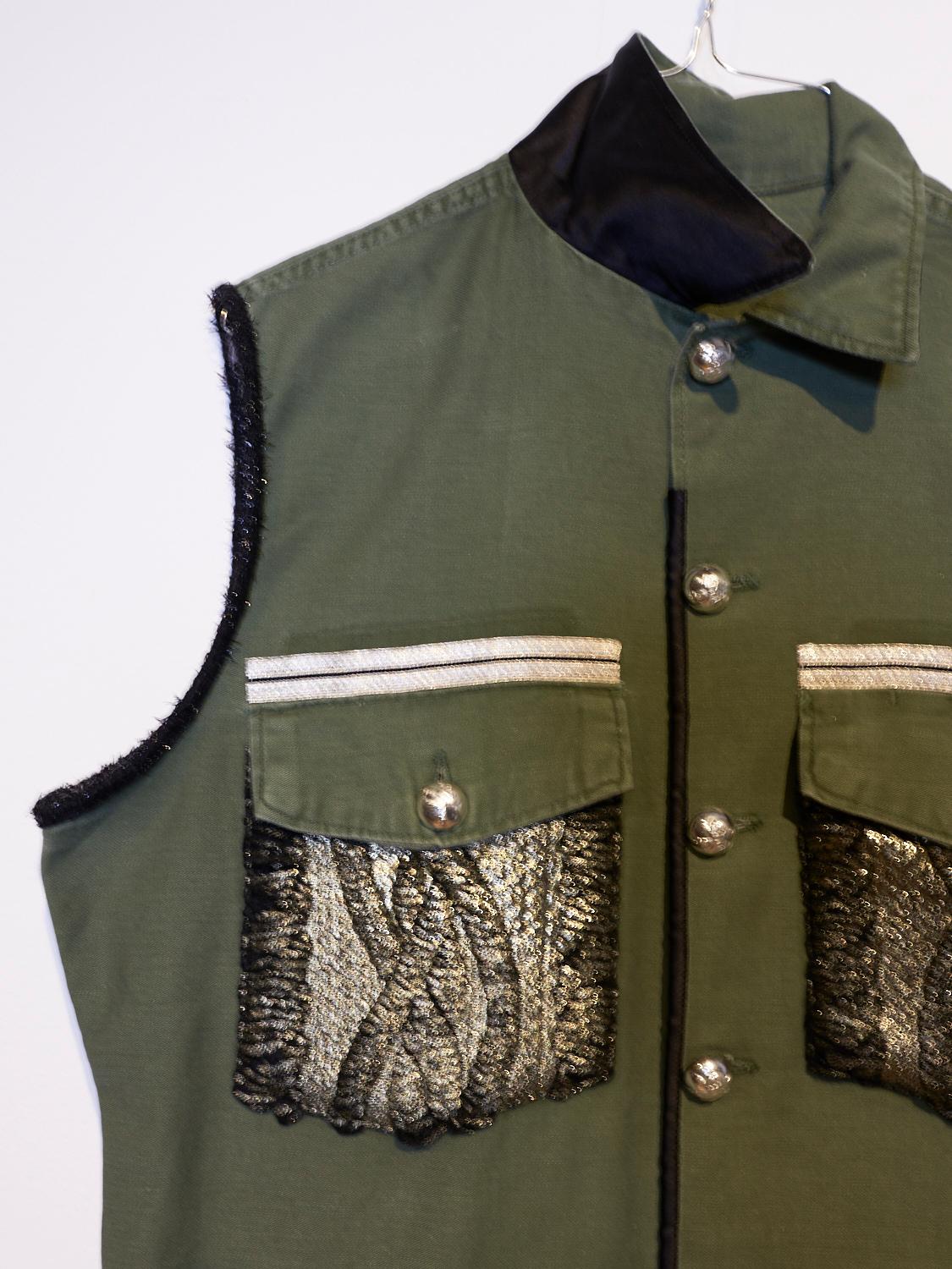 Embellished Sleeveless Jacket  Military Green Vest Gold Knit Pockets, Black Silk Collar and Vintage Silver Tone Brass Buttons. 
Can be worn as a Sleeveless Evening Blazer to black leather leggings or even to give a dress a more casual and versatile