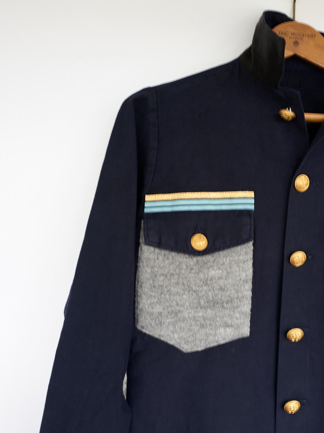 blue jacket with gold buttons