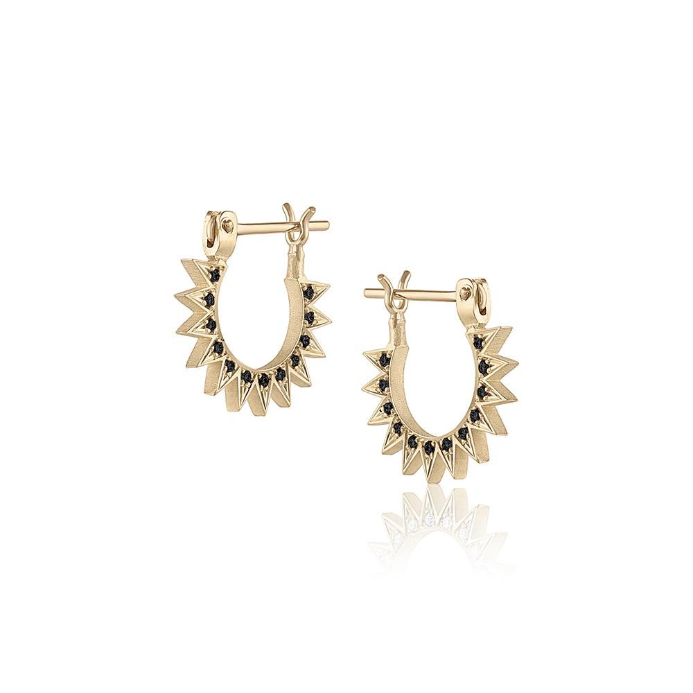 The Pavé Baby Spur Hoops – designed and handmade by EMBLM Fine Jewelry

Sold as a pair, the Pavé Baby Spur Hoops can be worn on either ear with the diamonds facing in or out. 

Product Details:
8mm inner diameter
14k yellow gold
pavé black