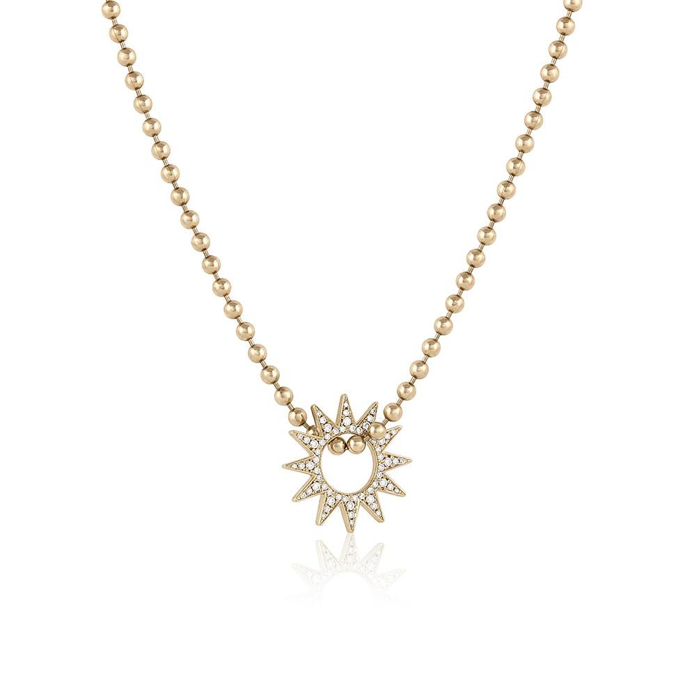 The Pavé Mini Spur Pendant – Designed and handmade by EMBLM Fine Jewelry 

The twelve point star shape of the Pavé Mini Spur Pendant moves freely on any chain. This piece is encrusted with pavé set white round brilliant cut diamonds, creating