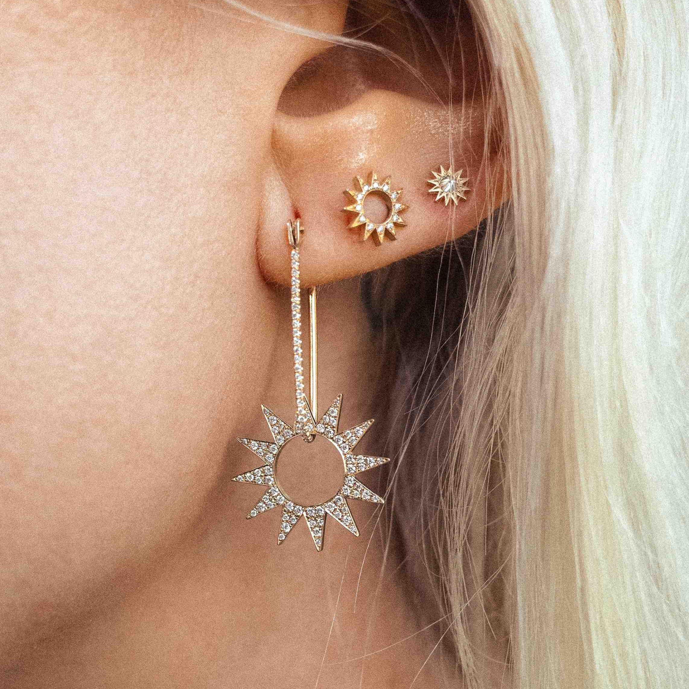 The Pavé Spur Earring – designed and handmade by EMBLM Fine Jewelry

The twelve point star shape of the Pavé Spur Earring Charm moves freely within the handmade oblong hoop of the Pavé Latch Earring. The two pieces can also be worn separately – the