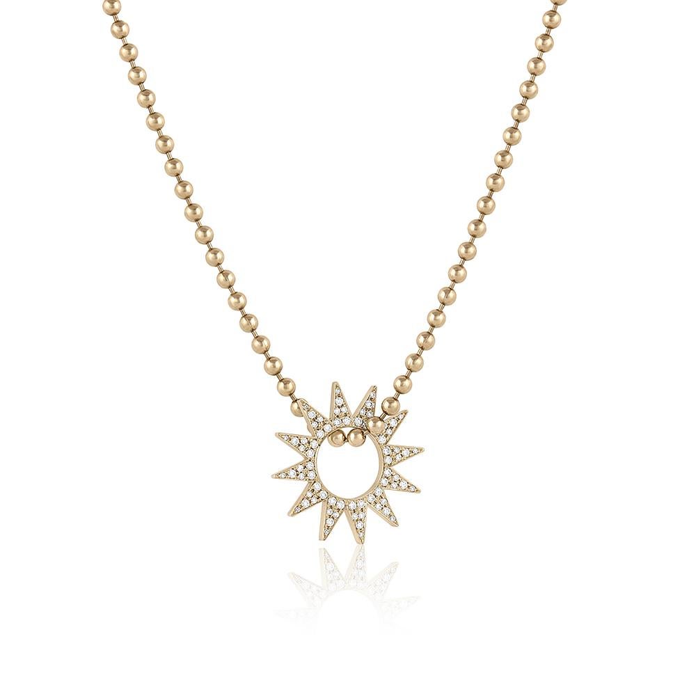 The Pavé Spur Pendant – Designed and handmade by EMBLM Fine Jewelry 

The twelve point star shape of the Pavé Spur Pendant moves freely on any chain. This piece is encrusted with pavé set white round brilliant cut diamonds, creating dazzling light