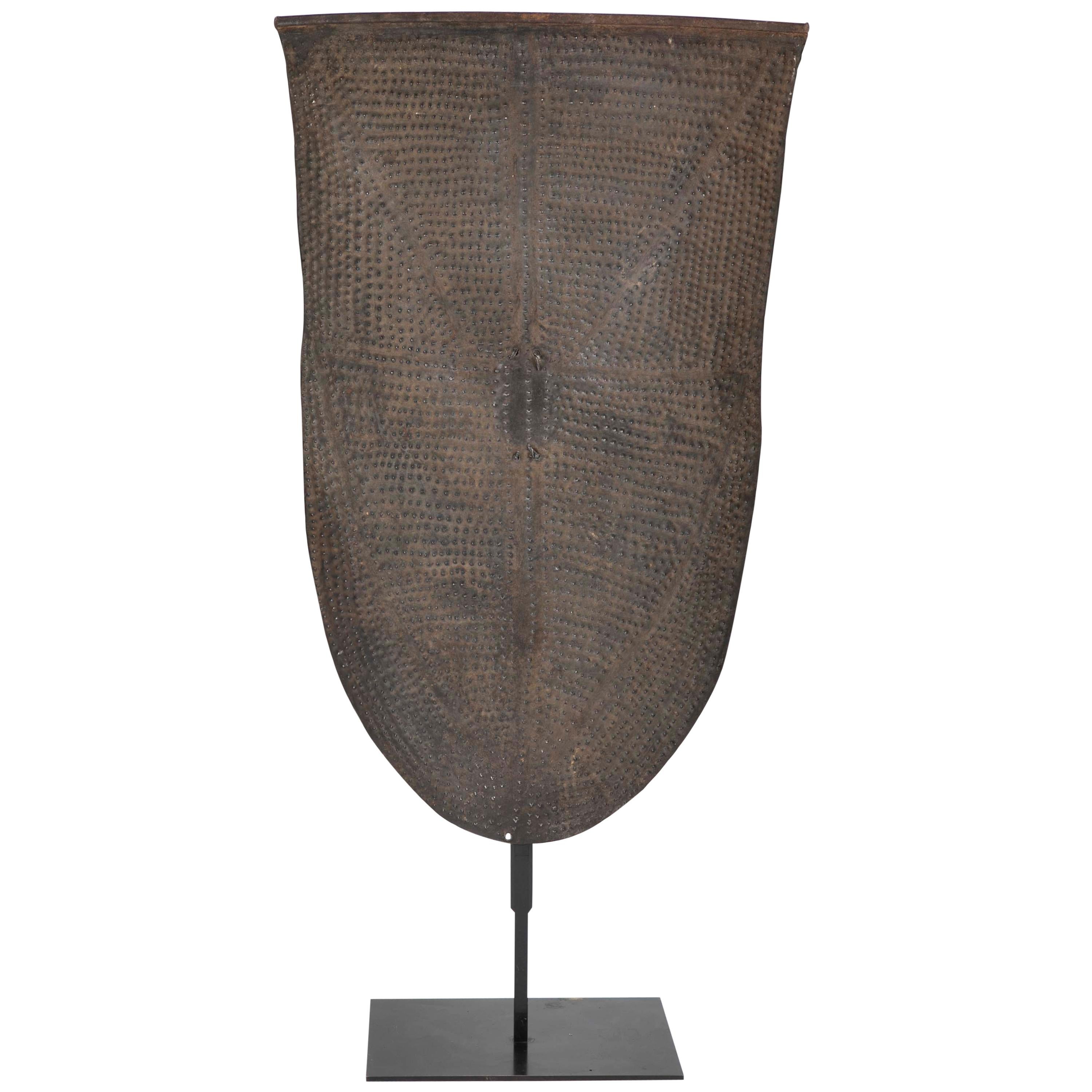 Embosed Metal Kirdi Shield from Cameroon on Bronze Stand For Sale