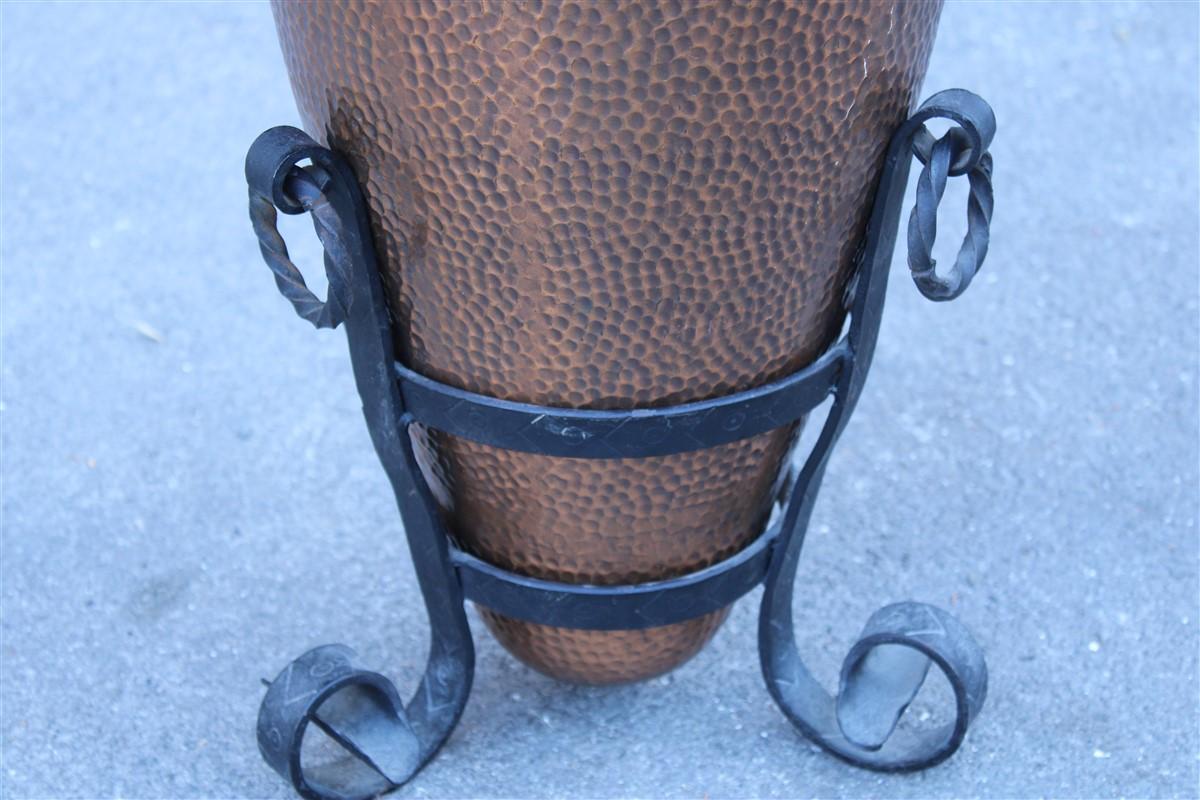 Embossed and hammered copper umbrella stand Italy 1950s forged iron base.