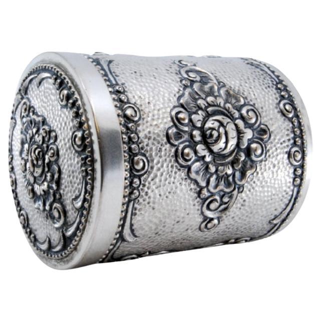 Embossed and hammered silver tea box