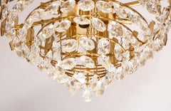 Embossed brass and crystal tiered chandelier by Palwa