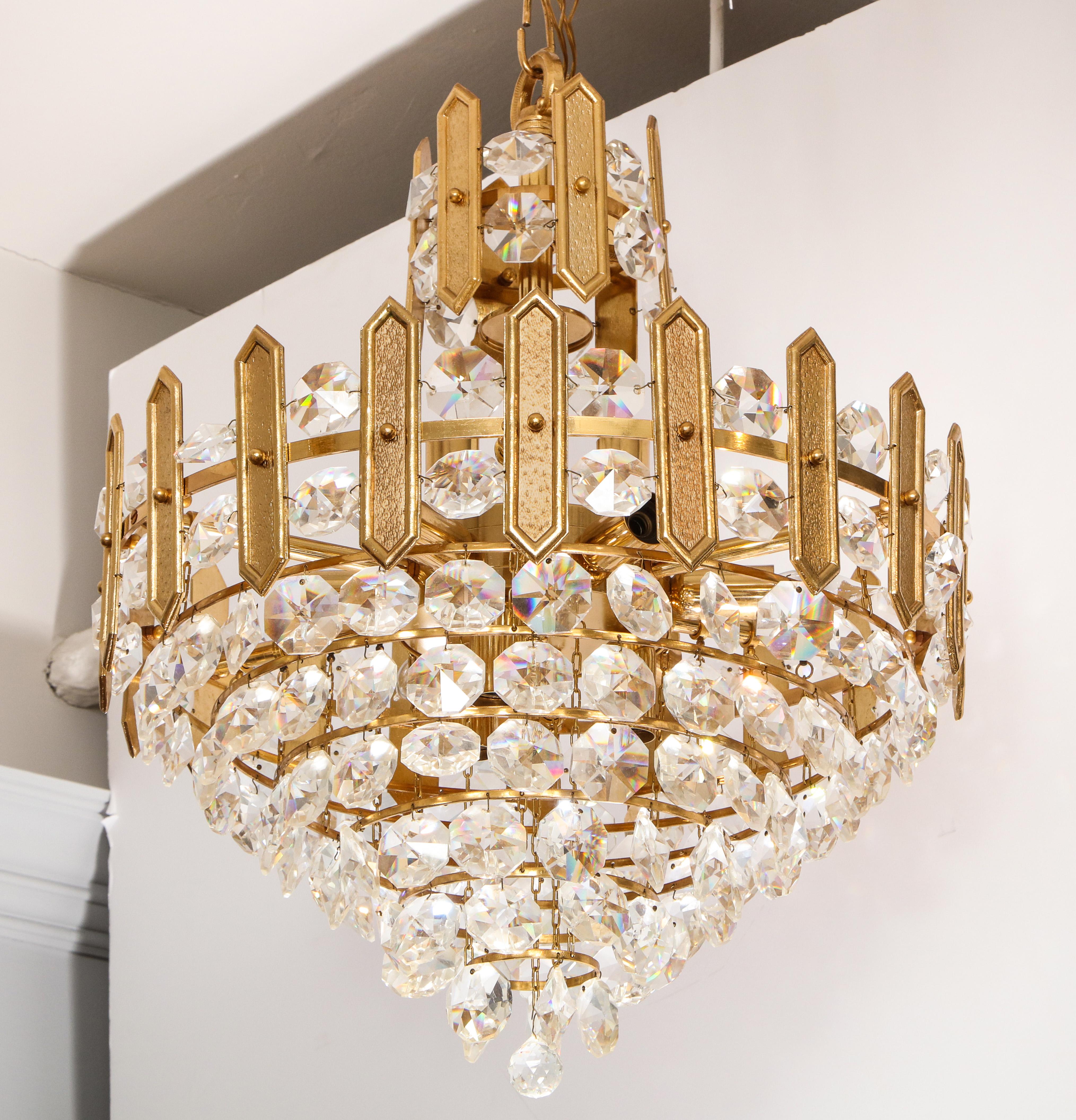 Embossed brass and crystal tiered chandelier by Palwa For Sale 1