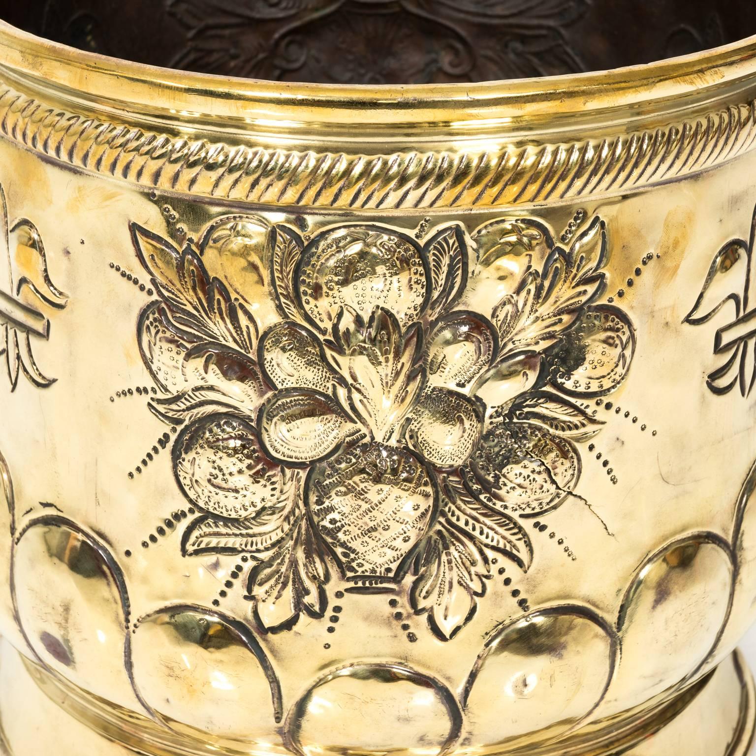 Embossed brass planter with lions head handles and fleur-de-lis detail, circa 1870.
 