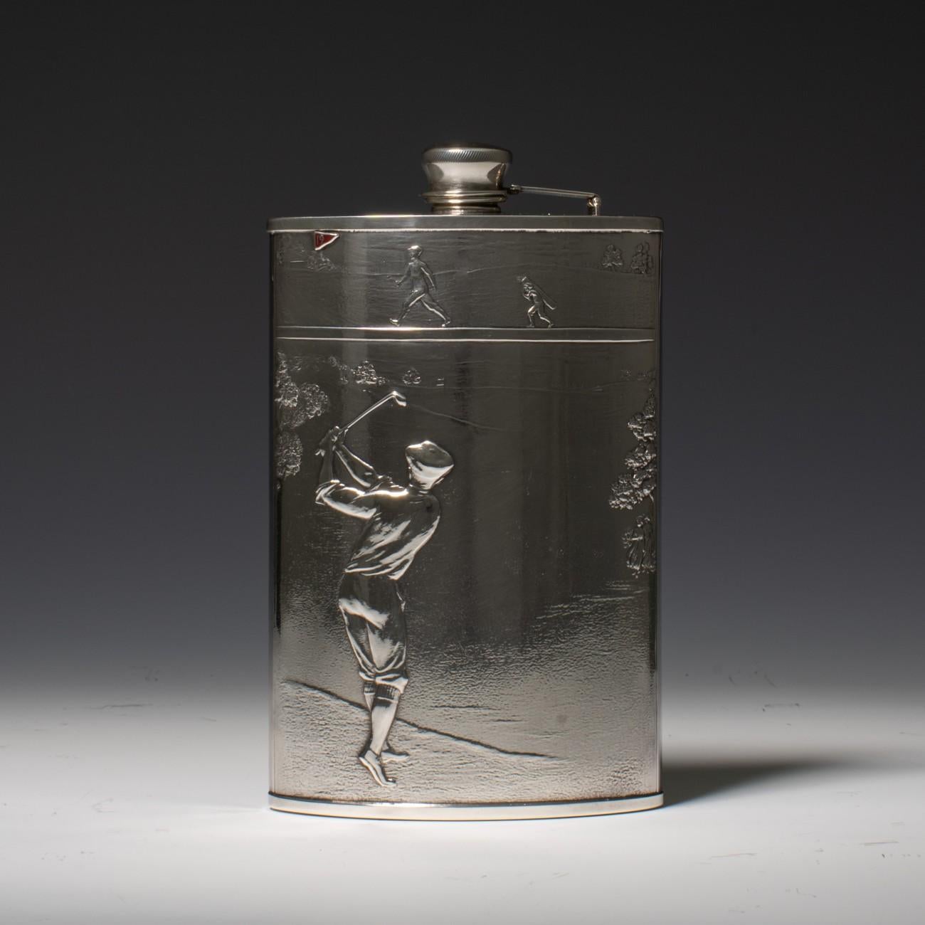 An American Golf hip flask with maker's mark for The Evans Nickel Silver Co. and stamped Nickel Silver, circa 1930. The body of the flask is embossed with a large central scene of a male golfer in full swing, with a golfer and boy caddy walking