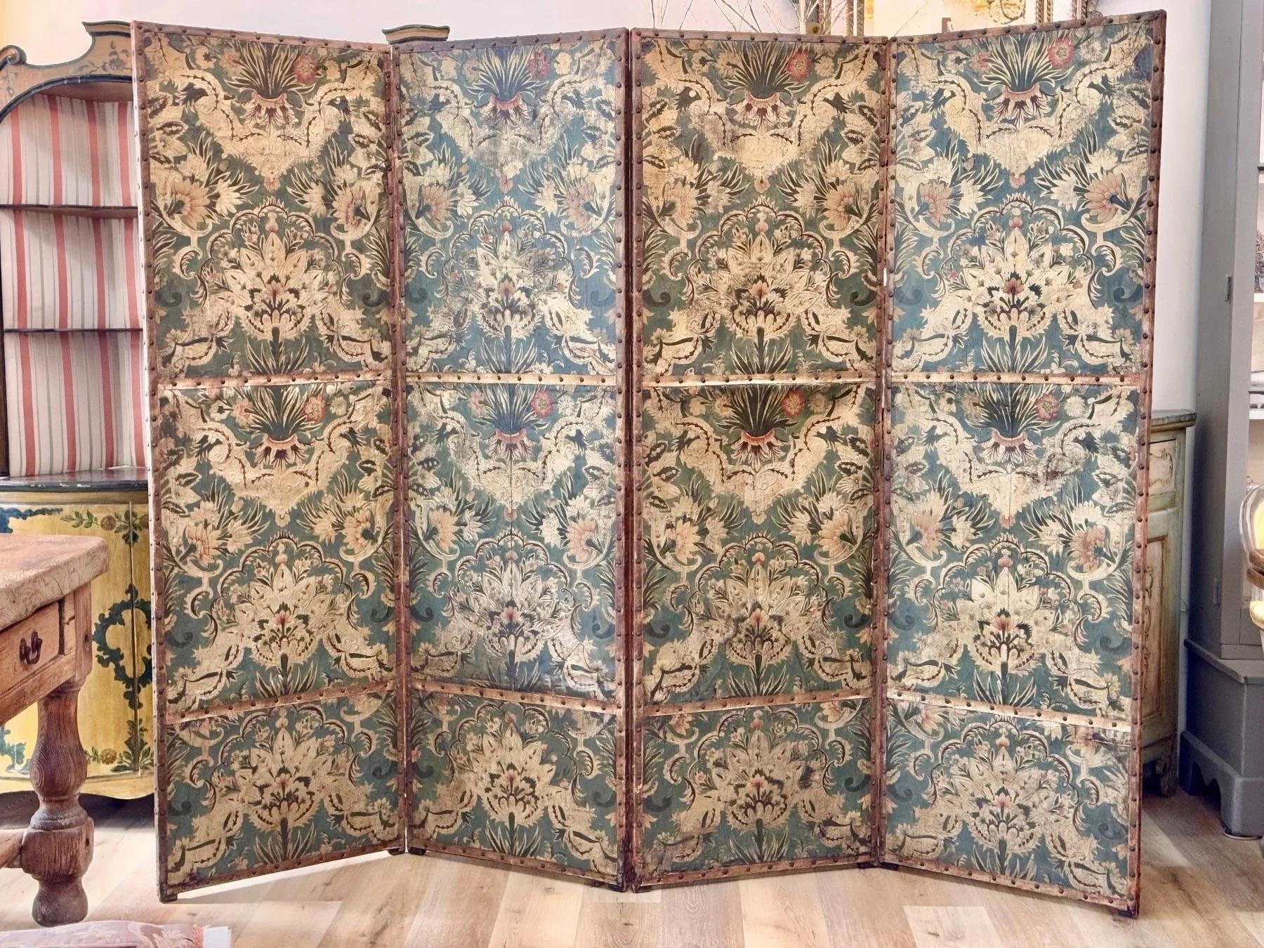 18th Century French or Dutch Folding Embossed Leather Screen of rare pale green coloring and pearlescent relief floral detail. Having 4 Panels 6 ft. 5 in. x 24 in., width of each panel

