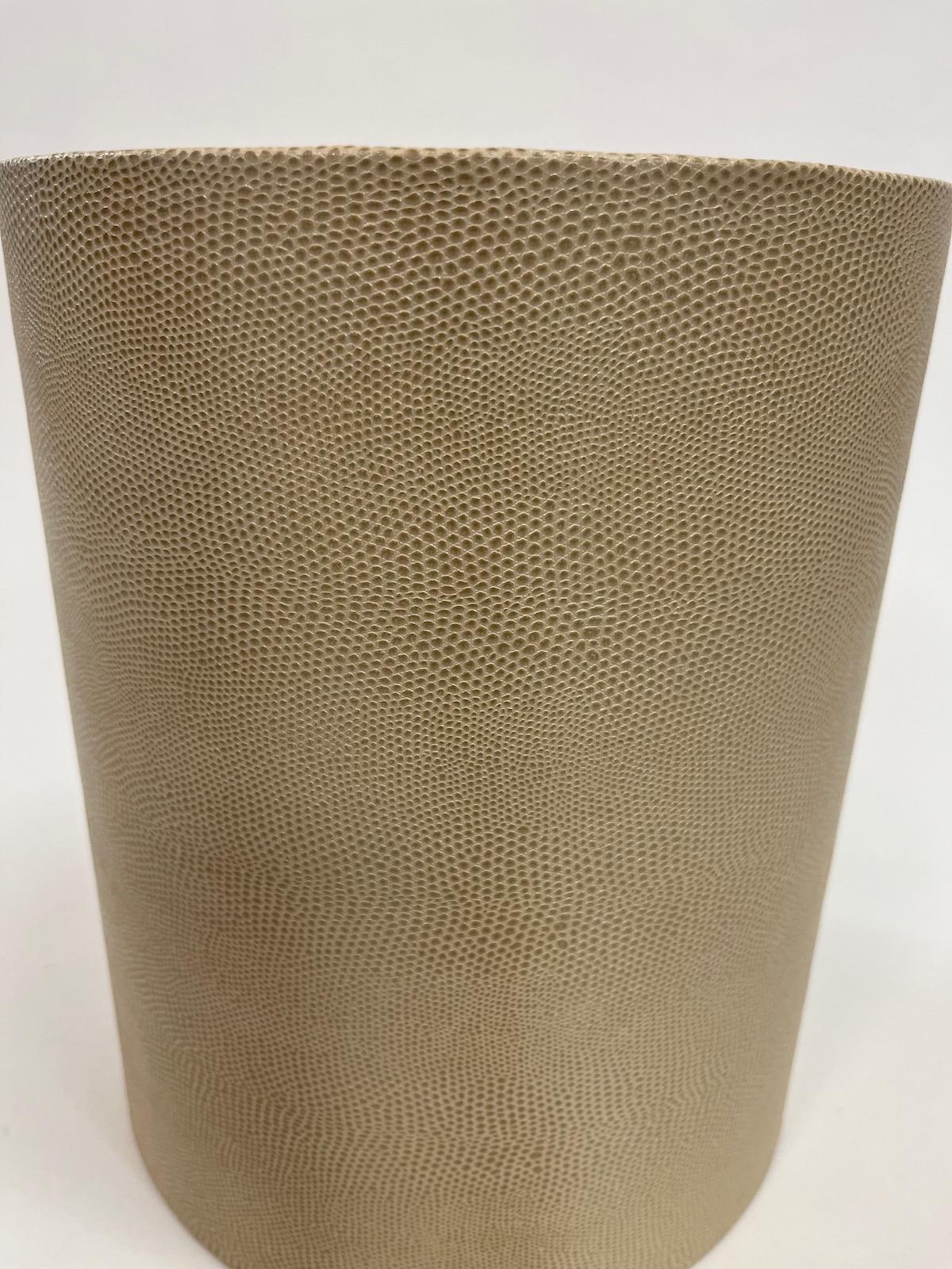 An embossed Lizard Skin Leather Waste Can.
A vintage example
Probably made by Maitland and Smith
