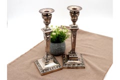 Embossed silver candlesticks