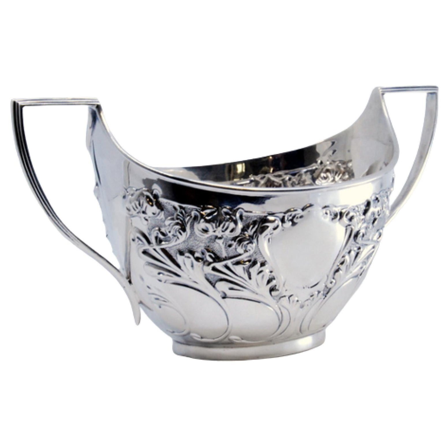 Embossed silver candy box with floral motifs, scrolls surrounding monogram cards