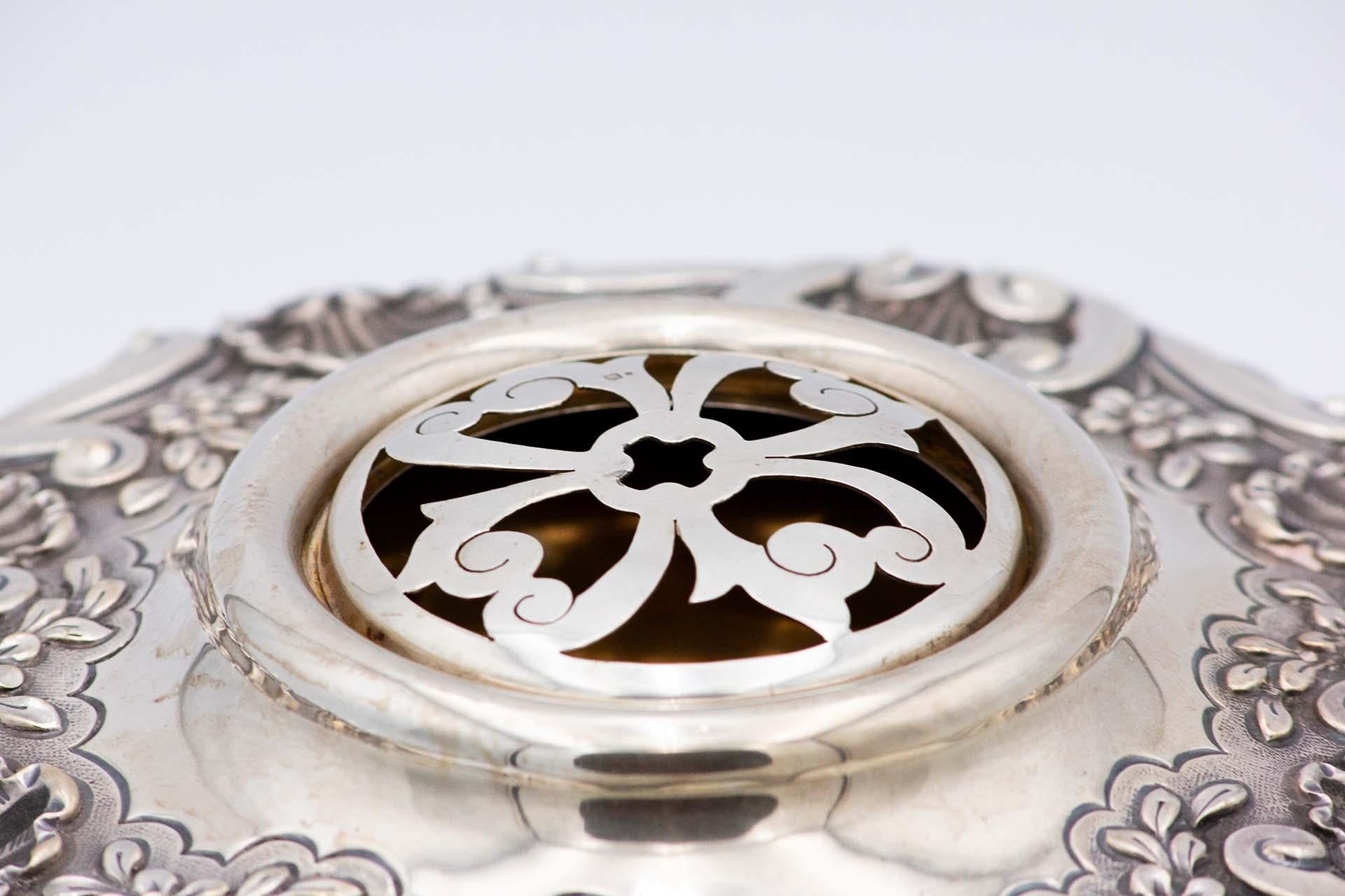 Description: Embossed silver centerpiece with mirror in the center. Metal: Silver. Origin: Portuguese. Mark: standing eagle. Weight: 1648.16 grams. Dimensions: 33.5cmx13.2cm. Content: 833/1000. Assay Mark: Yes, between 1938 and 1984. Additional