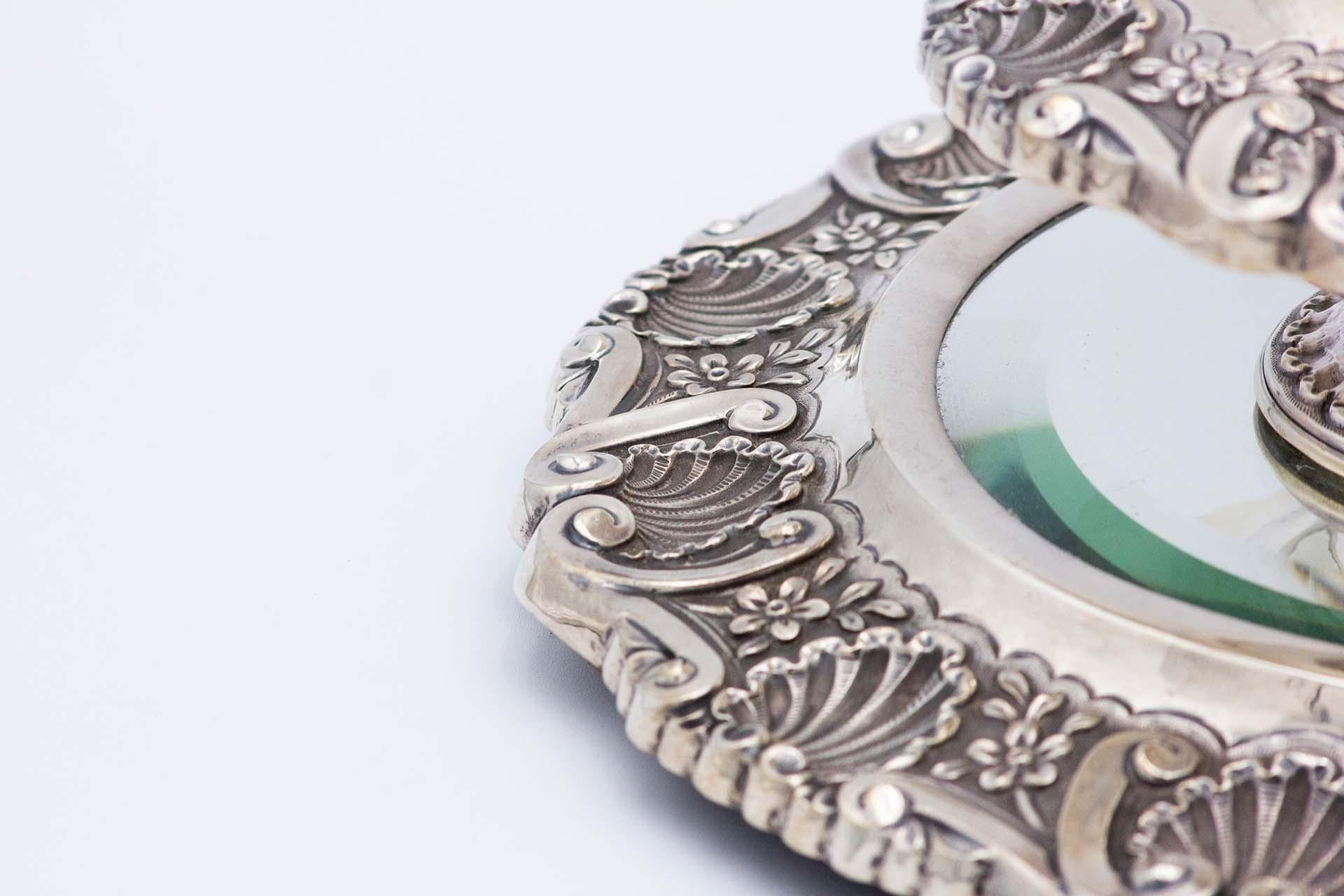 European Embossed silver centerpiece with mirror in the center For Sale