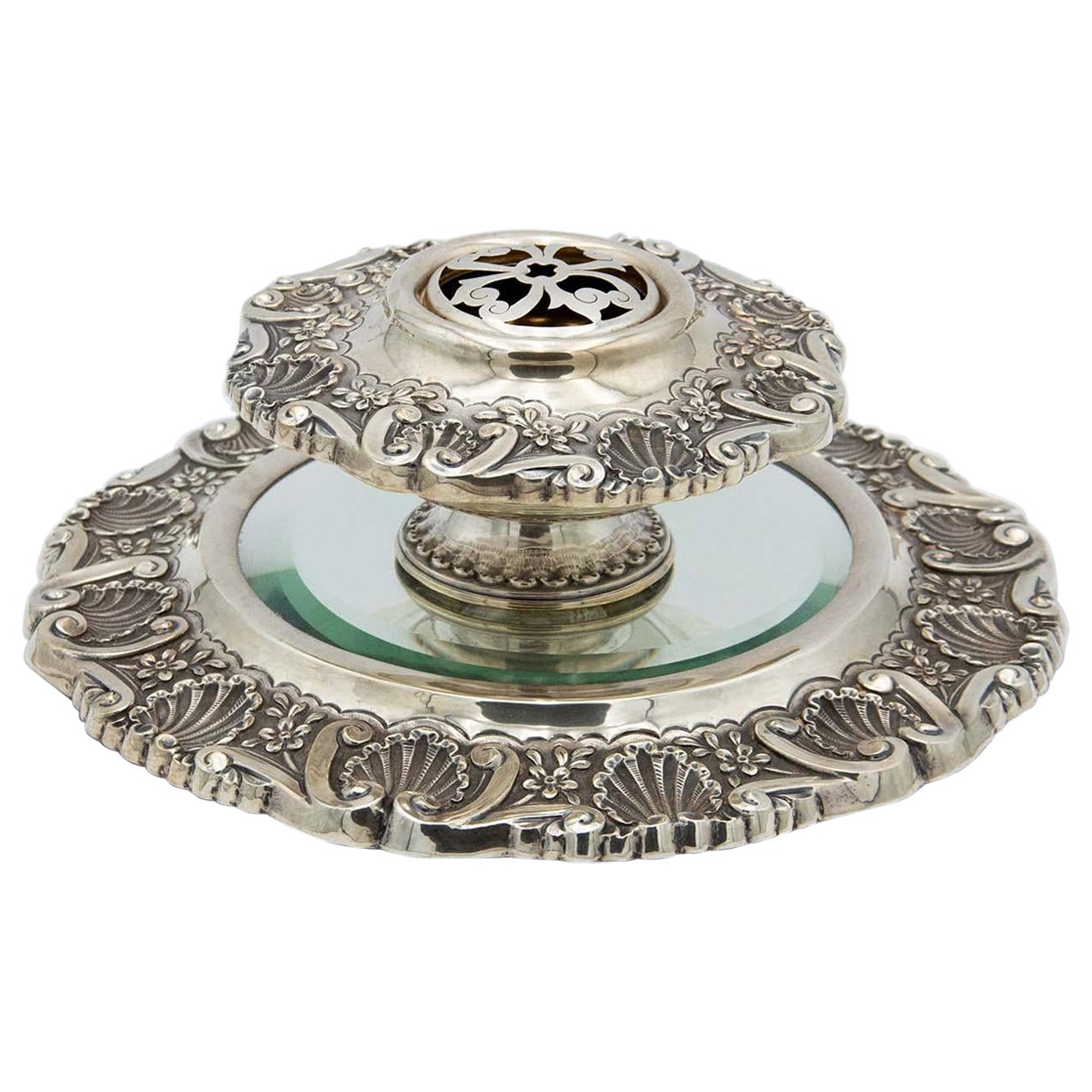 Embossed silver centerpiece with mirror in the center