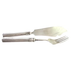 Embossed silver cheese knife and fork