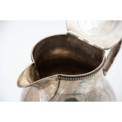 Embossed silver coffee maker