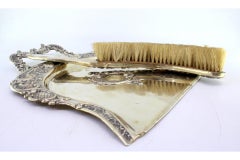 Embossed silver crumb set w/ garlands around central monogram