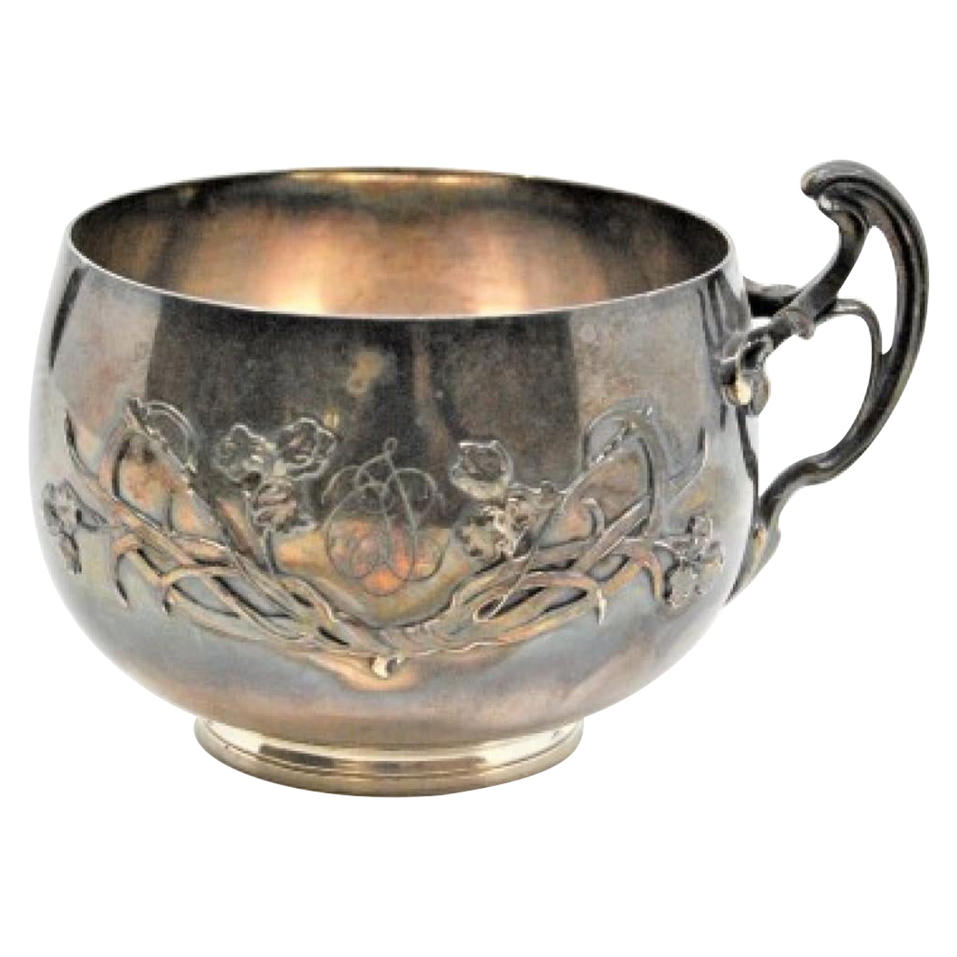 Embossed silver cup with floral motifs and bows on the handle