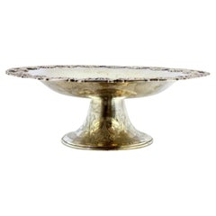 Embossed silver fruit centerpiece with bows, garlands and pearl trim