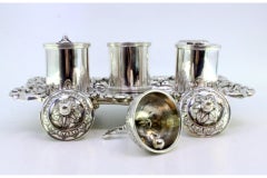 Embossed silver inkwell with reservoirs, bell & claw-shaped feet