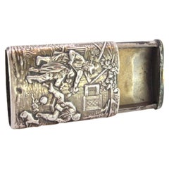 Embossed silver matchbox with players in everyday scenes and sliding lid