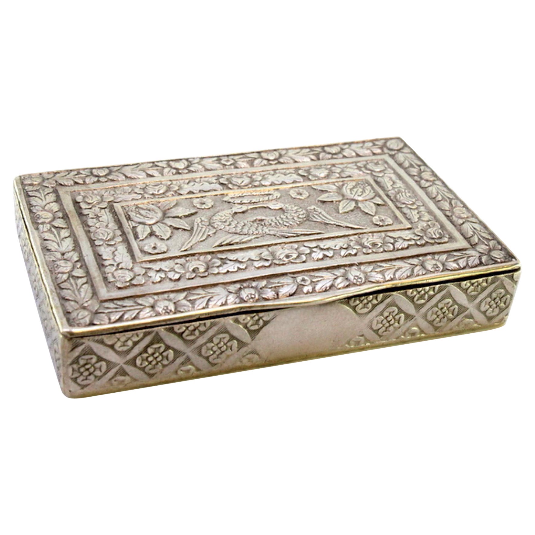 Embossed silver snuff box with birds around monogram card