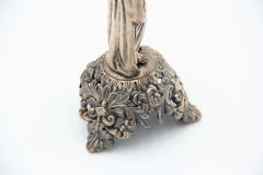 Embossed silver toothpick holder with a structure alluding to a woman