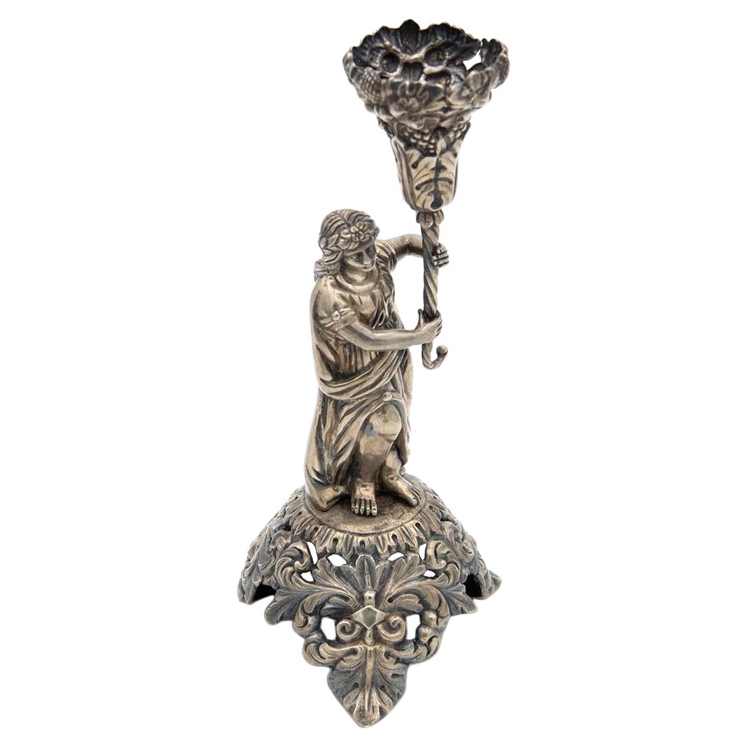 Embossed silver toothpick holder with a structure alluding to a woman