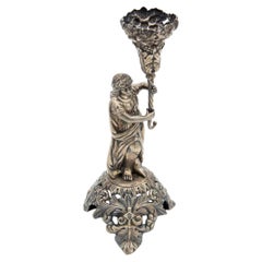 Embossed silver toothpick holder with a structure alluding to a woman