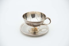 Embossed teacup with guilloche silver saucer, pearl trim and embossed handle